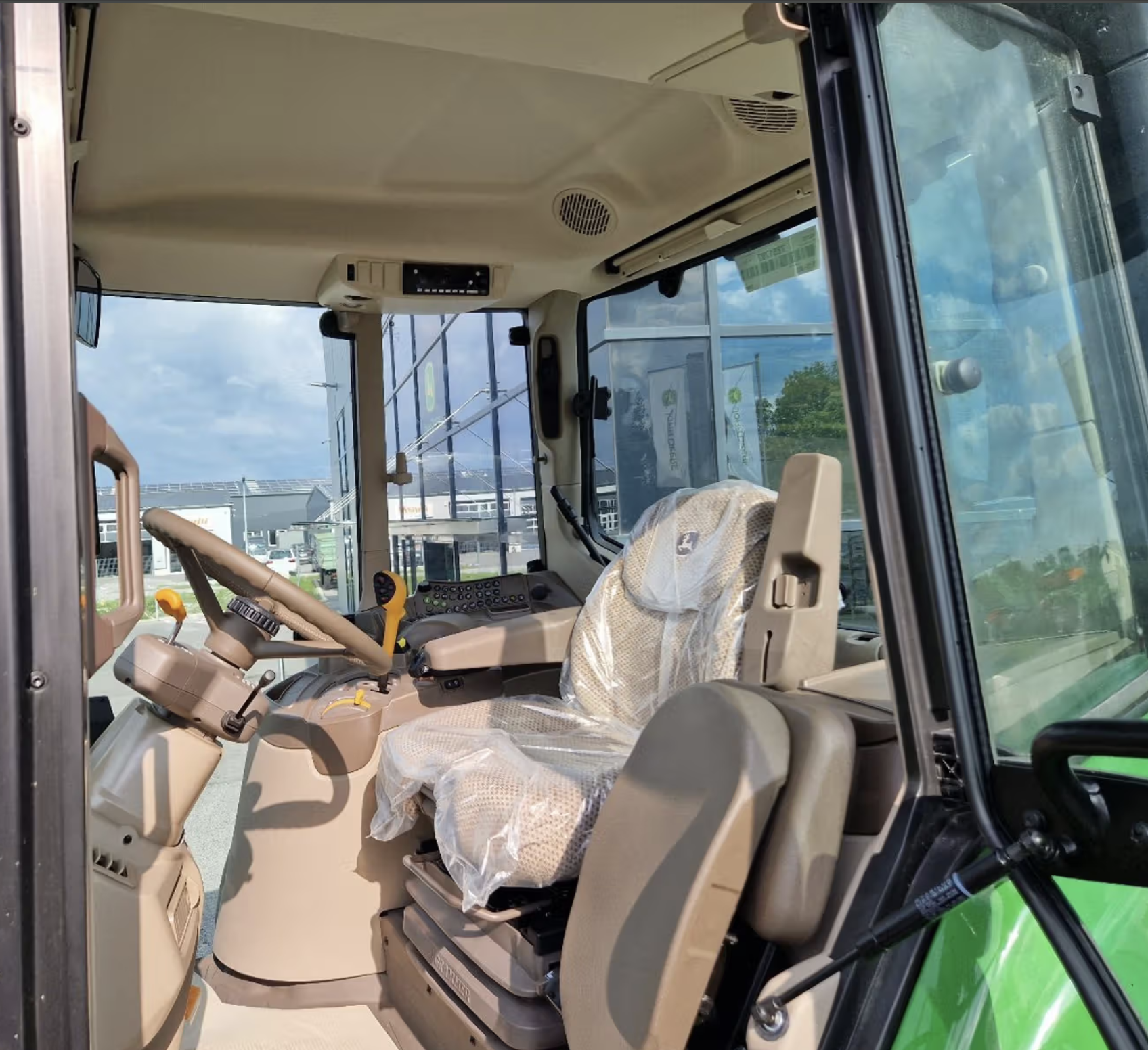 John Deere 6195M tractor